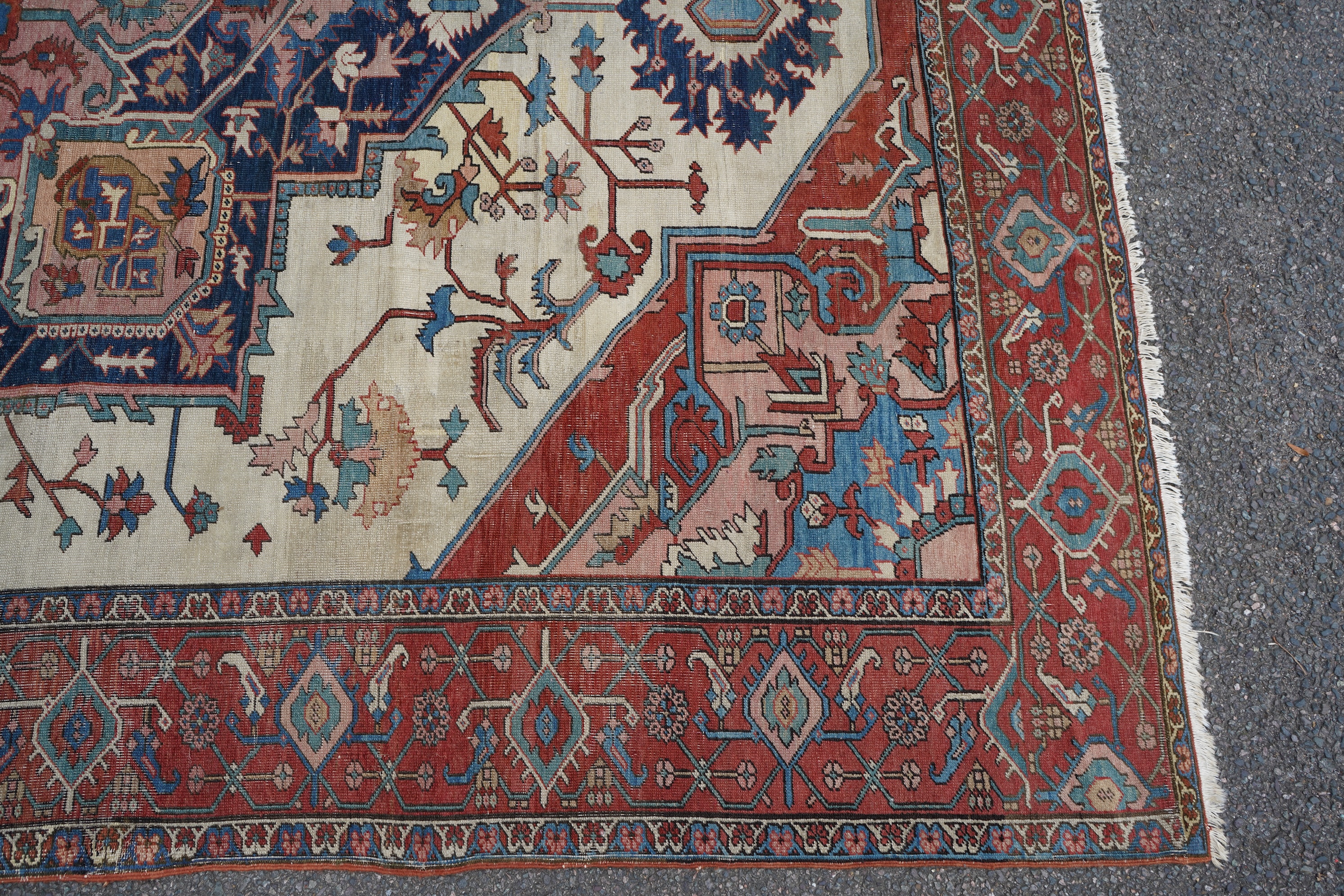 An early 20th century Heriz ivory ground carpet